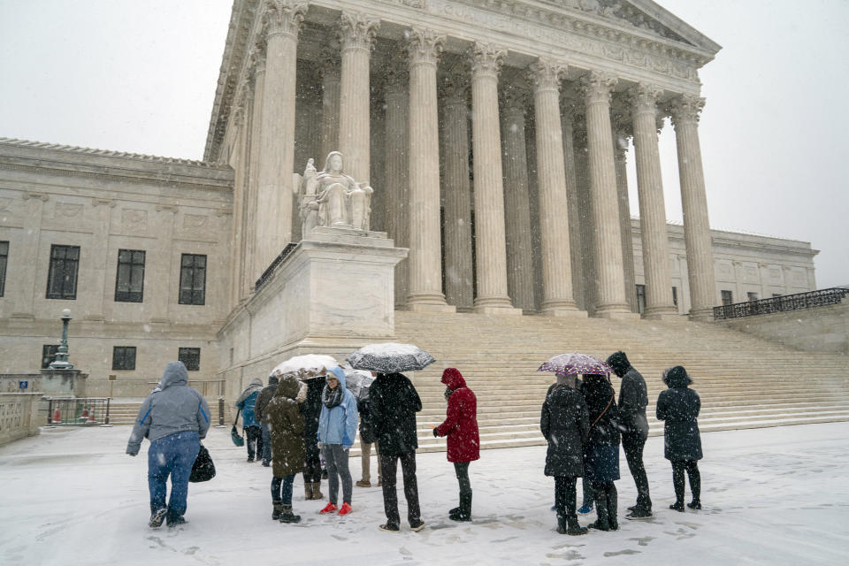 <p>Visitors wait to enter the Supreme Court as a winter snow storm hits the nation's capital making roads perilous and closing most Federal offices and all major public school districts, on Capitol Hill in Washington, Wednesday, Feb. 20, 2019. The Supreme Court is ruling unanimously that the Constitution's ban on excessive fines applies to the states. The outcome Wednesday could help an Indiana man recover the $40,000 Land Rover police seized when they arrested him for selling about $400 worth of heroin. (AP Photo/J. Scott Applewhite) </p>
