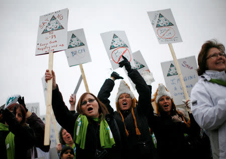 FILE PHOTO: Pro-gun registry demonstrators take part in the National Day of Remembrance and Action on Violence Against Women rally on Parliament Hill in Ottawa, Ontario, Canada, December 6, 2011. The rally was held to commemorate the Montreal Massacre of December 6, 1989, in which 14 women at Montreal's Ecole Polytechnique were killed by gunman Marc Lepine. REUTERS/Chris Wattie/File Photo