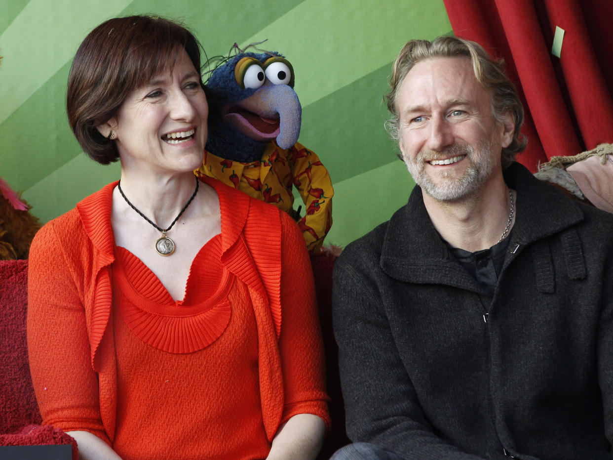 Muppet character Gonzo is pictured with Lisa Henson (L) CEO of The Jim Henson Company and her brother Brian Henson, chairman of The Jim Henson Company during ceremonies honoring the Muppets with a star on the Hollywood Walk of Fame in Hollywood, California March 20, 2012. REUTERS/Fred Prouser (UNITED STATES - Tags: ENTERTAINMENT)