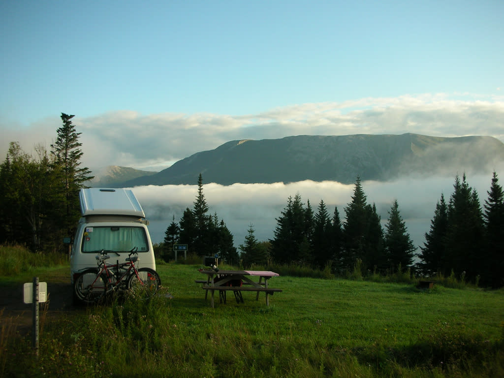 Camping offers lots of perks, like this gorgeous morning view, but you don't want to spend more than you need to make it happen. (Carlos Baquero/ Flickr