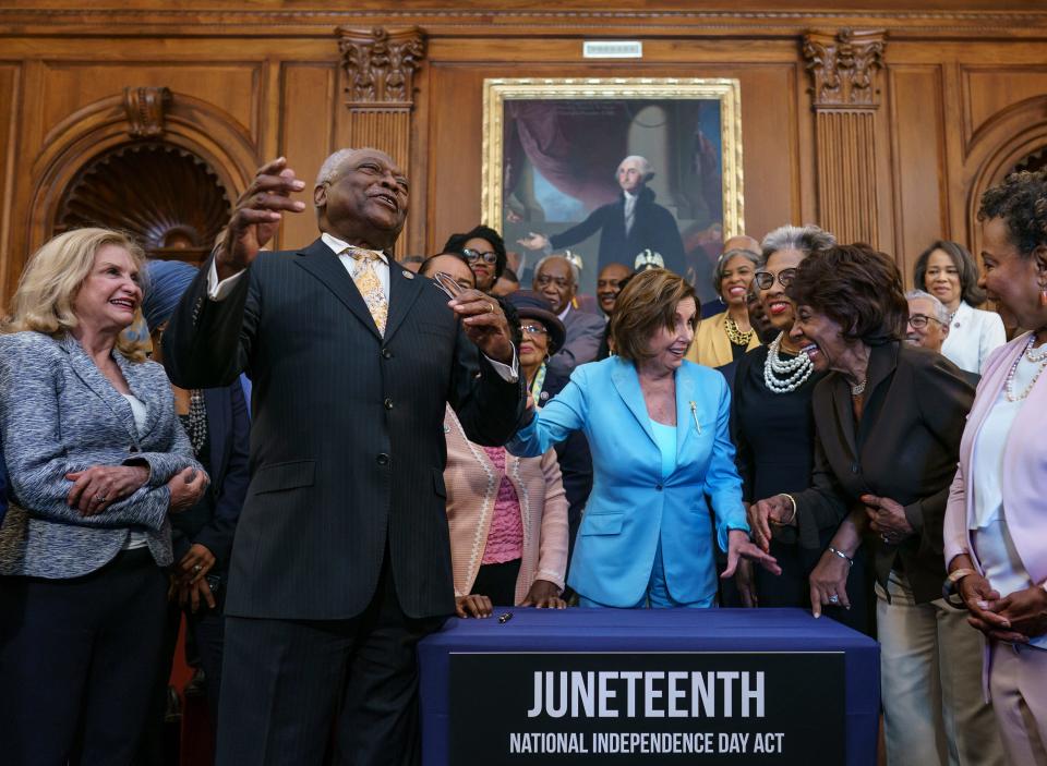 House Majority Whip James Clyburn, D-S.C., left, celebrated with Speaker of the House Nancy Pelosi and members of the Congressional Black Caucus on June 17, 2021, after the passage of a bill to make Juneteenth a federal holiday.