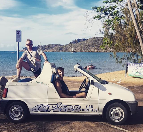 The two men are pictured smiling in a rental car in Queensland before the shark attack. Source: Instagram