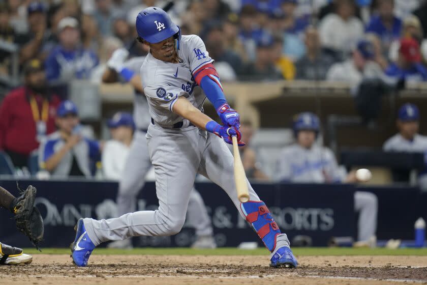 Los Angeles Dodgers' Miguel Vargas hits a two-run single during the sixth inning of the team's baseball game against the San Diego Padres, Thursday, Sept.  29, 2022, in San Diego.  (AP Photo/Gregory Bull)