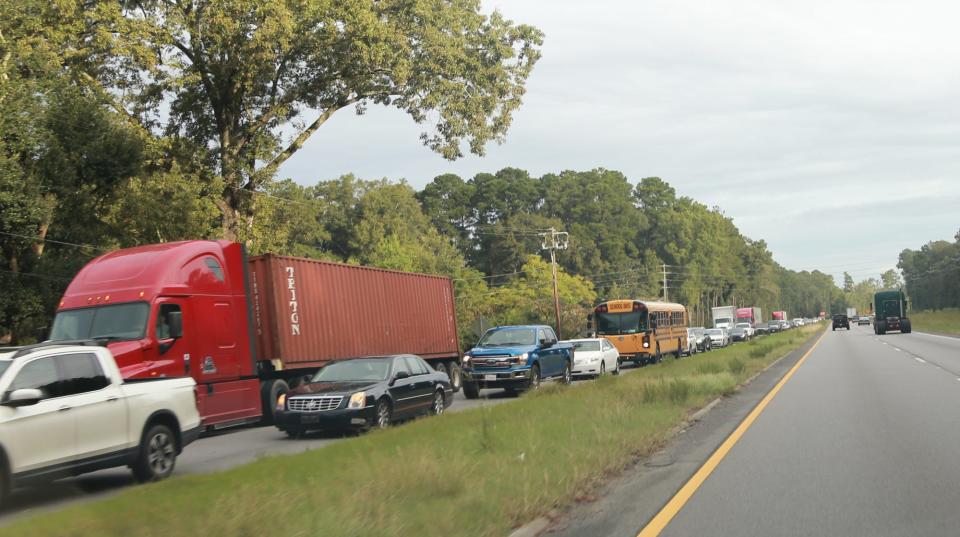 Motorists wait for traffic to let up on Highway 21 in Port Wenworth, a key artery that flows directly into Effingham County.