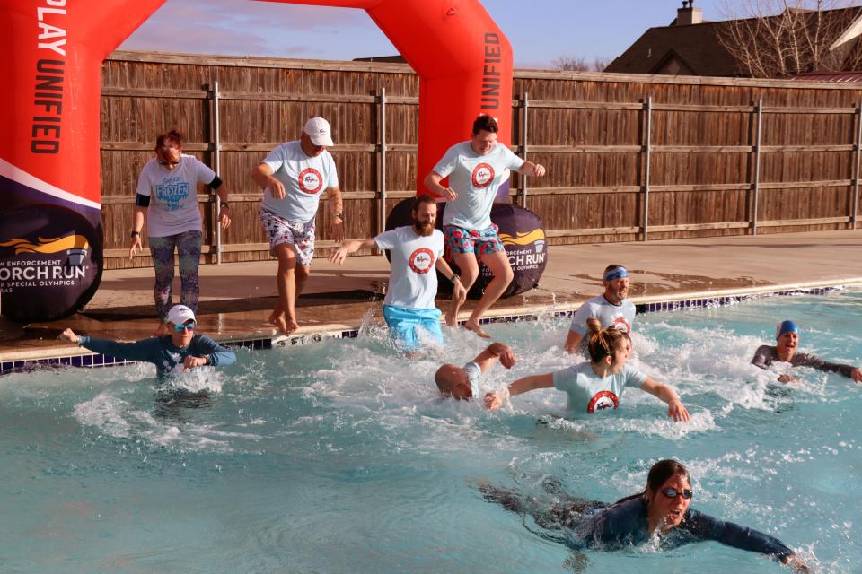 The team from Get Fit takes the plunge as they participate in the annual Special Olympics Polar Plunge held at Amarillo Town Club on Hillside Saturday morning.