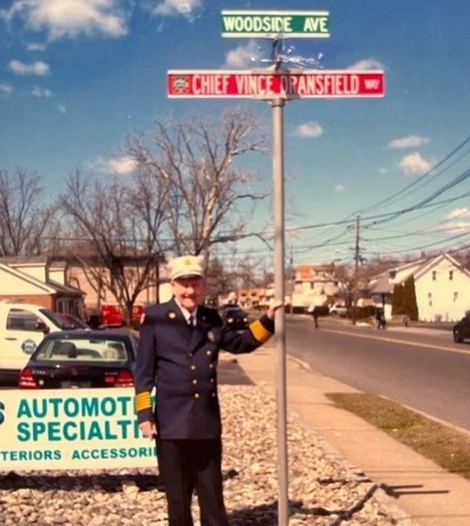 Dransfield poses with a street sign in his honor. Singacfirecompany3/Instagram