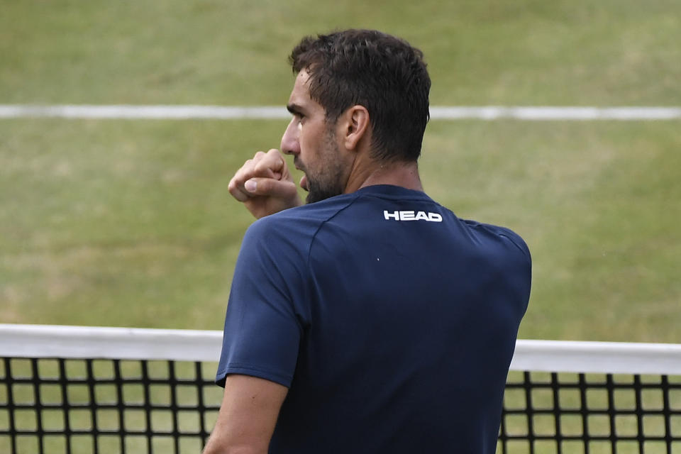 Marin Cilic of Croatia celebrates his win against Fabio Fognini of Italy during their singles tennis match at the Queen's Club tournament in London, Wednesday, June 16, 2021.(AP Photo/Alberto Pezzali)