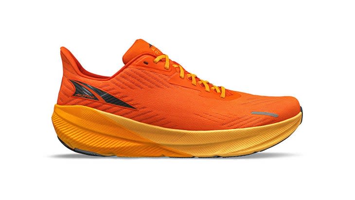 An orange shoe with a yellow outsole