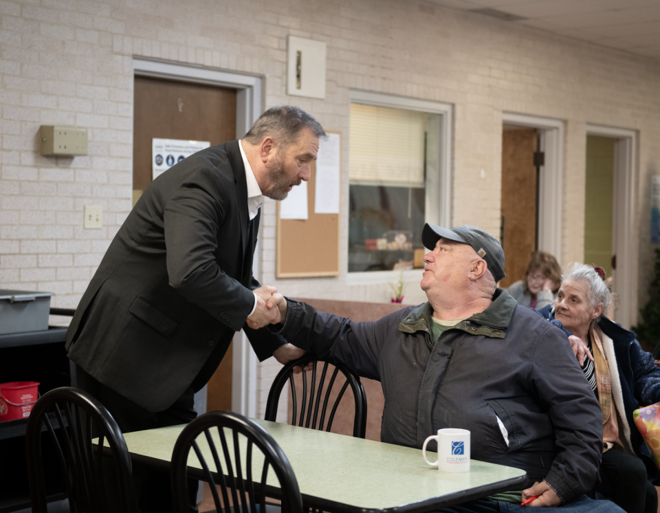 Ohio Attorney General Dave Yost, left, chats with Mark Cash during a visit Thursday, March 7, 2024, to Center of Hope in Ravenna. Center of Hope and Kent Social Services received a portion of a $1 million settlement with Dollar General.