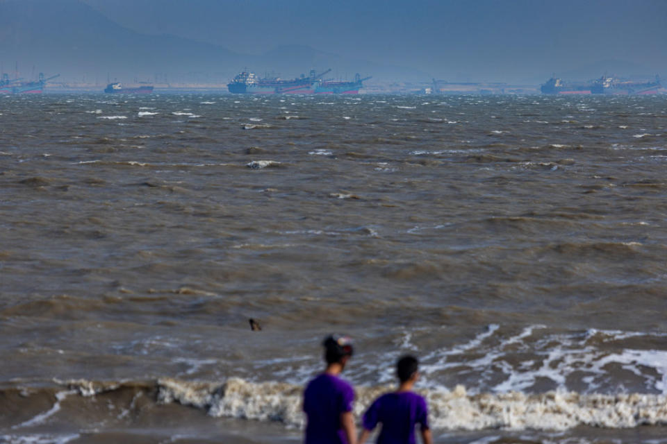 Chinese sand dredgers are seen from a local beach on September 24, 2022 in Kinmen, Taiwan. Kinmen, an island in the Taiwan strait that is part of Taiwan's territory, is so close to China that the deep-water port of Xiamen, one of China's biggest, lies less than three miles away across the water. It is one of the few areas of Taiwan that mainland Chinese tourists can visit without visas or permits, and has deep ties with the adjacent Fujian province of China.<span class="copyright">Annabelle Chih-Getty Images</span>