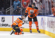 Edmonton Oilers' Connor McDavid (97) and Leon Draisaitl (29) celebrate a goal against the New York Rangers during the third period of an NHL hockey game Friday, Nov. 5, 2021, in Edmonton, Alberta. (Jason Franson/The Canadian Press via AP)