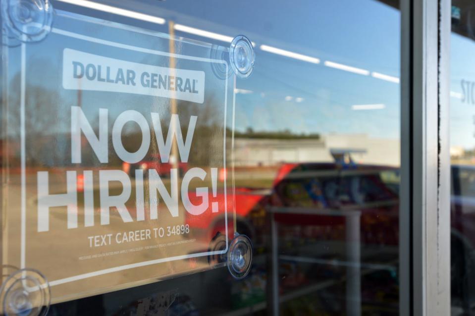 A help-wanted sign is posted in the window of a Dollar General store in this undated photo. Augusta-area employment numbers are inching upward toward pre-pandemic levels, according to new labor statistics.