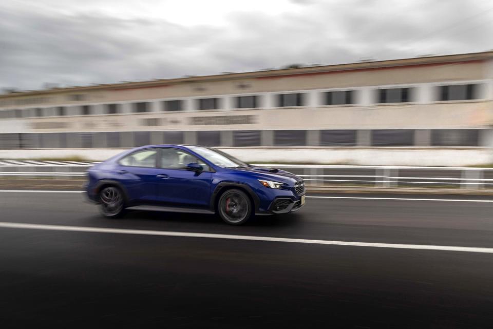 A WRX TR passes the Targa Florio's historic pits, which still stand today.