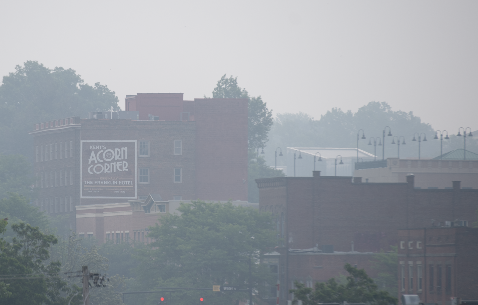 Smoke from Canadian wildfires hangs heavy in the air Wednesday in downtown Kent.