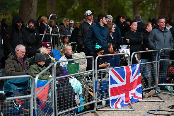 Mourners wrapped in blankets ahead of the State Funeral of Queen Elizabeth II on September 19, 2022, in London.