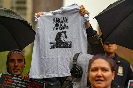 A small crowd of protesters rally for the disciplinary trial of Police officer Daniel Pantaleo in relation to the death of Eric Garner at 1 Police Plaza in the Manhattan borough of New York, New York, U.S., May 13, 2019. REUTERS/David 'Dee' Delgado