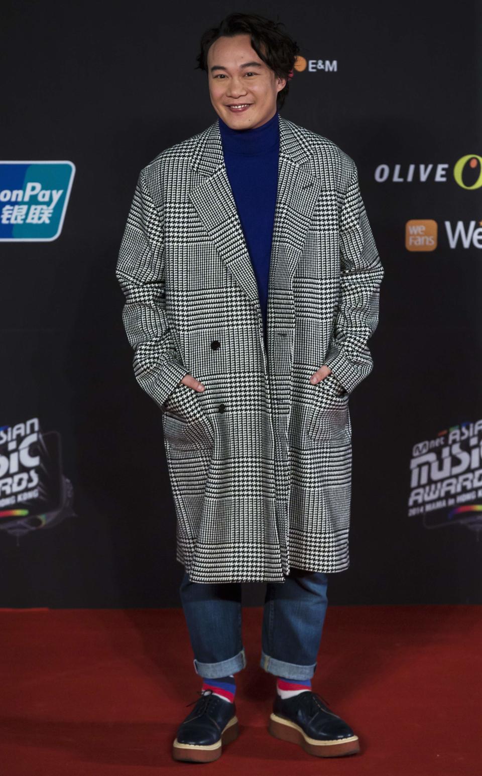 Hong Kong singer Eason Chan poses on the red carpet as he attends the 2014 Mnet Asian Music Awards (MAMA) in Hong Kong