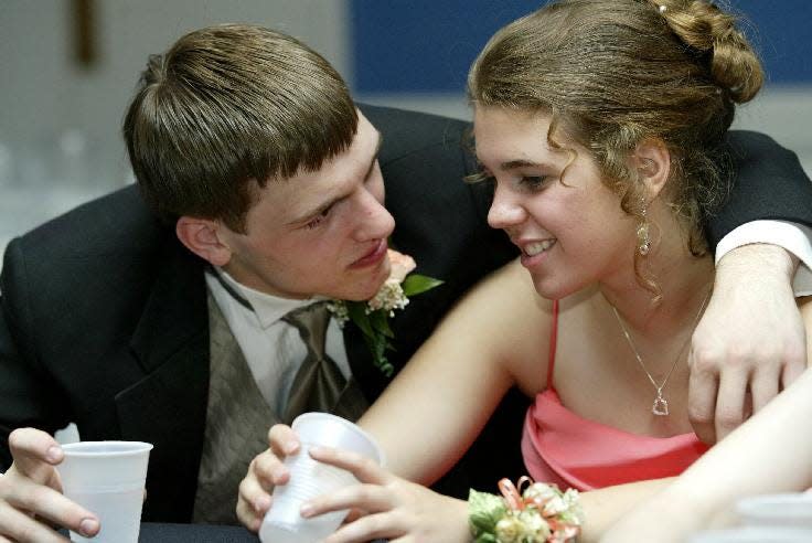 2005: Alex Rizzo, 16 of Schenectady High has a moment with Chenango Forks High School Junior Elaina Dybas, 17 Friday night During Chenango Forks High School Prom, at the Binghamton Regency, Binghamton. 
