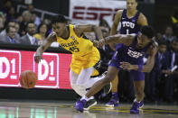 Baylor guard Davion Mitchell, left, battles TCU guard RJ Nembhard, right, for a loose ball in the second half of an NCAA college basketball game, Saturday, Feb. 1, 2020, in Waco, Texas. Baylor won 68-52. (AP Photo/Rod Aydelotte)
