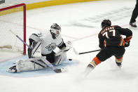 Los Angeles Kings goaltender David Rittich, left, stops a shot by Anaheim Ducks right wing Frank Vatrano during the second period of an NHL hockey game Saturday, April 13, 2024, in Los Angeles. (AP Photo/Mark J. Terrill)