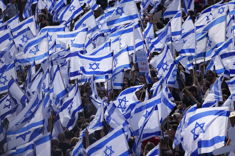 Israelis protest against Prime Minister Benjamin Netanyahu's judicial overhaul plan outside the parliament in Jerusalem, Monday, March 27, 2023. (AP Photo/Ariel Schalit)