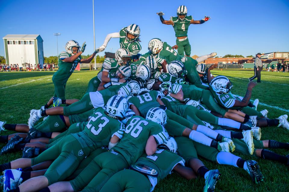 The Richwoods Knights do their traditional dog pile before the start of their varsity football game against the Peoria High Lions on Thursday, Sept. 29, 2022 at Richwoods Stadium in Peoria. The Knights fell to the Lions 66-12.