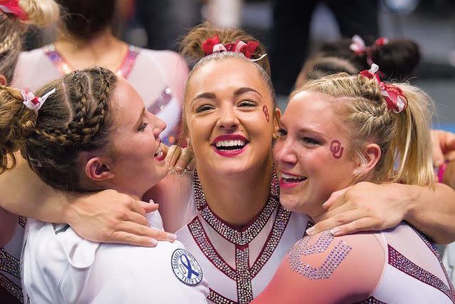 <p>Credit: Amy Pyle</p> Maggie Nichols with University of Oklahoma gymnastics teammates after winning the 2017 NCAA title.