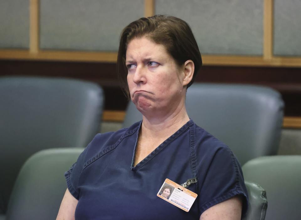 Defendant Sarah Boone listens to her court-appointed attorney Patricia Cashman during a pre-trial hearing in Orlando, Fla., Friday, June 7, 2024. Boone was arrested after detectives said her boyfriend died when he climbed into a suitcase as a joke and she zipped him inside. (Joe Burbank/Orlando Sentinel via AP)