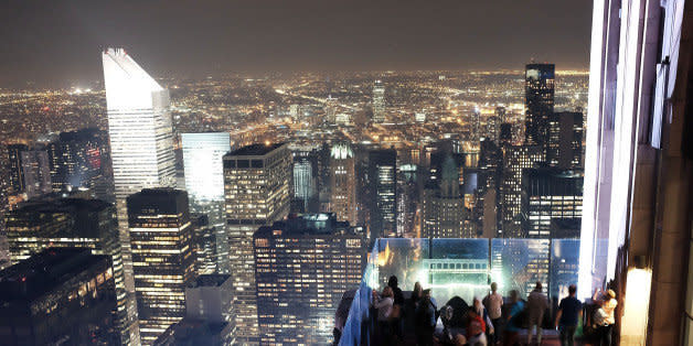 NEW YORK, NY - MAY 05:   People congregate on the top of Rockefeller Center's viewing deck 'Top of the Rock' to view the Manhattan skyline on May 5, 2015 in New York City. In an effort to reduce Manhattan's carbon footprint, New York's City Council is considering a bill that would limit the amount of external light commercial buildings may use when empty at night. If approved, the bill could alter the use of lights in nearly 40,000 structures and potentially change the iconic nighttime view of Manhattan. The controversial bill has received support from Mayor Bill de Blasio.  (Photo by Spencer Platt/Getty Images) (Photo: )