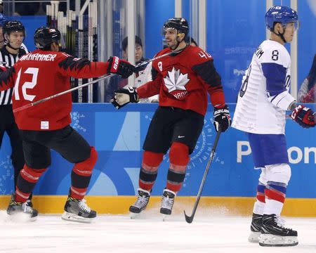 Ice Hockey - Pyeongchang 2018 Winter Olympics - Men's Preliminary Round Match - Canada v South Korea - Gangneung Hockey Centre, Gangneung, South Korea - February 18, 2018. Maxim Lapierre of Canada celebrates scoring a goal with Rob Klinkhammer. REUTERS/Brian Snyder