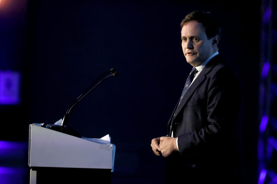 Tom Tugendhat at the podium in Belfast.