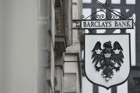 A logo hangs outside a branch of Barclays bank in London July 30, 2013. Barclays is raising 5.8 billion pounds ($8.9 billion) from its shareholders to help plug a larger-than-expected capital shortfall identified by Britain's financial regulator at the 320-year-old bank. REUTERS/Toby Melville