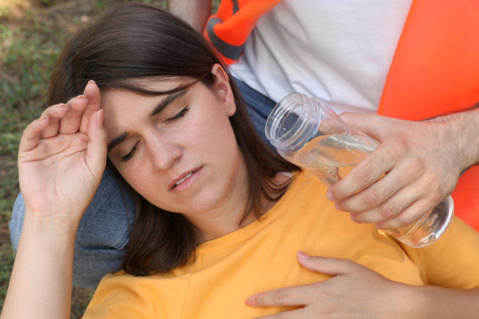 If you see someone suffering from heat stroke get them to drink water, and remove any tight clothing. (Photo via Getty Images)