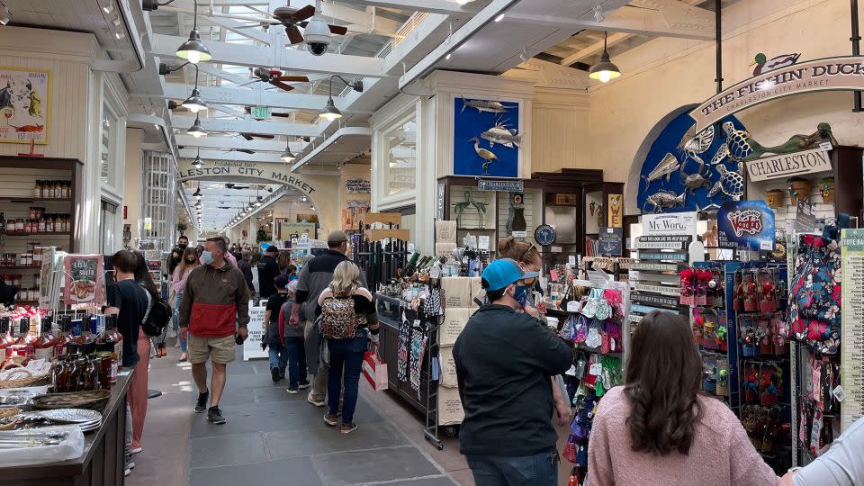 People shop in the historic Charleston City Market, South Carolina, in 2021. - Daniel Slim/AFP/Getty Images