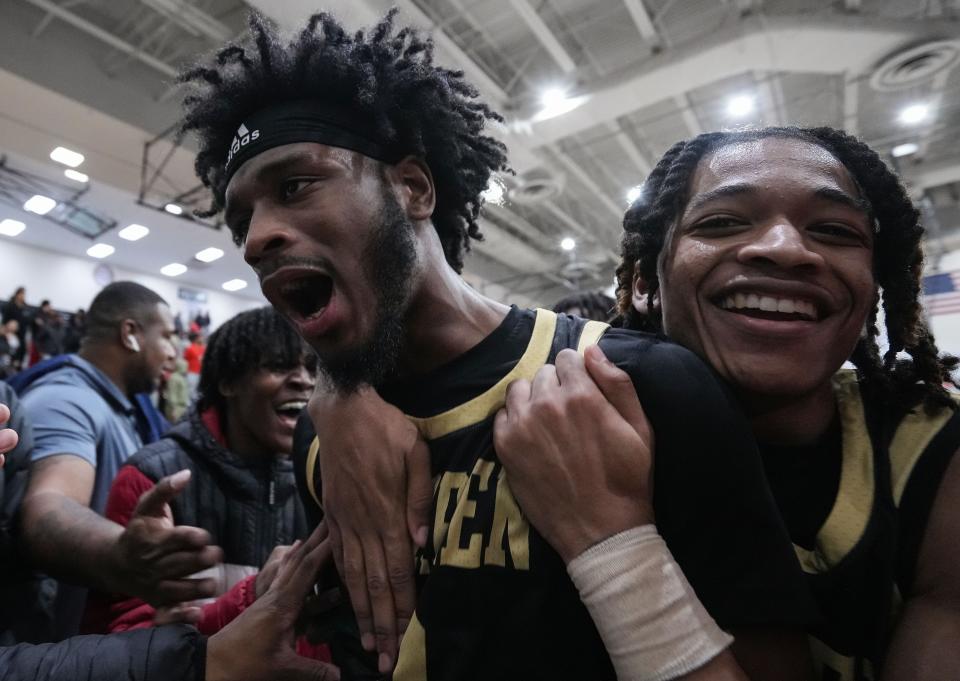 Warren Central's guard Devaon Holman (3) yells in excitement with Warren Central's guard Cordale Edwards (12) on Tuesday, Feb. 28, 2023 at Warren Central High School in Indianapolis. Warren Central defeated the Lawrence Central Bears in overtime, 61-58.