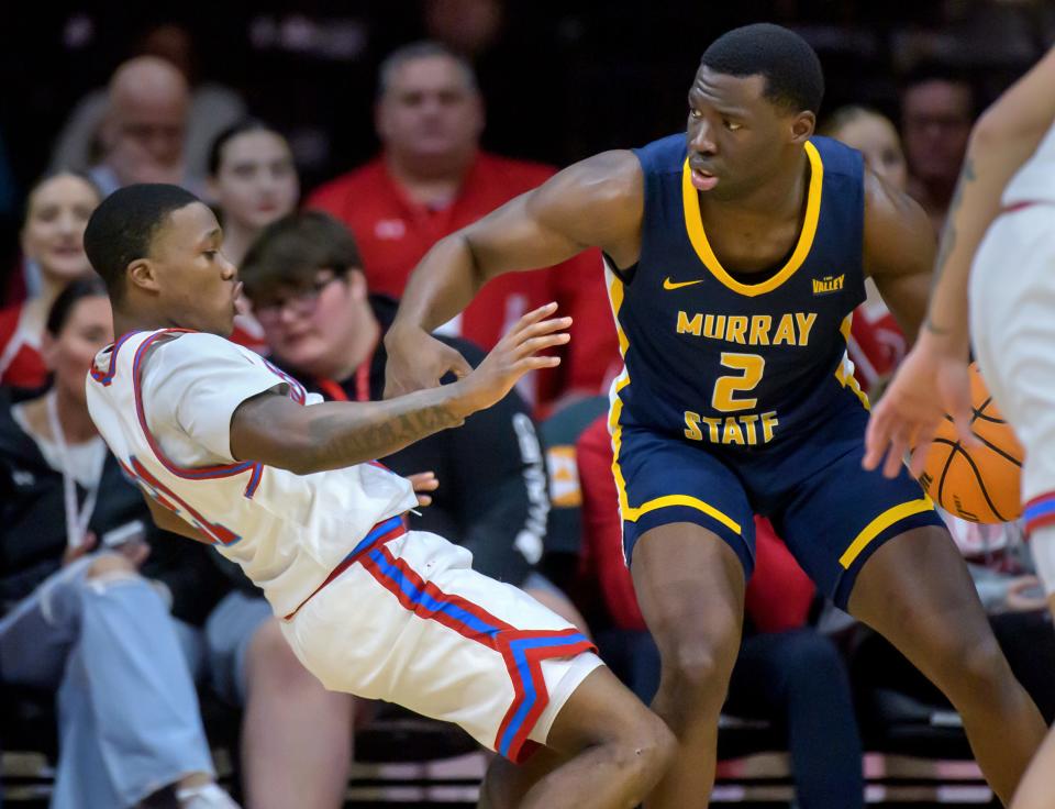 Murray State's Rob Perry (2) collides with Bradley's Duke Deen in the first half of their Missouri Valley Conference basketball game Wednesday, Jan. 24, 2024 at Carver Arena in Peoria. The Braves defeated the Racers 71-63.