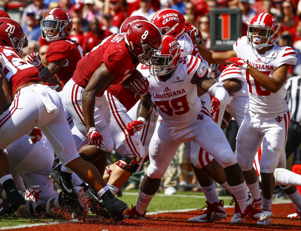 Alabama running back Josh Jacobs (8) carries the ball in for a touchdown against Louisiana-Lafayette during the first half of an NCAA college football game, Saturday, Sept. 29, 2018, in Tuscaloosa, Ala. (AP Photo/Butch Dill)