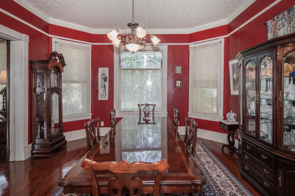 The formal dining room is adjacent to the parlor.