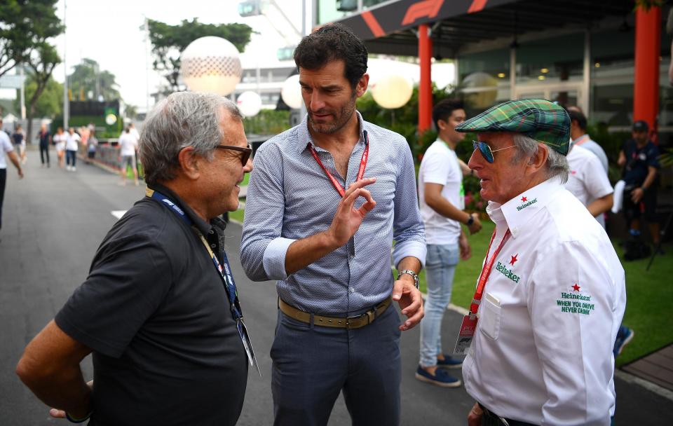 Former Red Bull star Mark Webber (centre) is sceptical that a July start is possible (Getty Images)