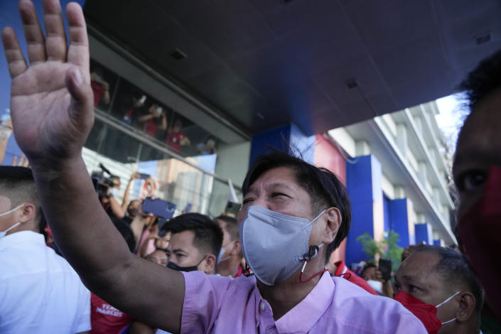 Presidential candidate Ferdinand "Bongbong" Marcos Jr. greets the crowd as he celebrates outside his headquarters in Mandaluyong, Philippines on Wednesday, May 11, 2022. Marcos' apparent landslide victory in the Philippine presidential election is raising immediate concerns about a further erosion of democracy in Asia and could complicate American efforts to blunt growing Chinese influence and power in the Pacific. (AP Photo/Aaron Favila)