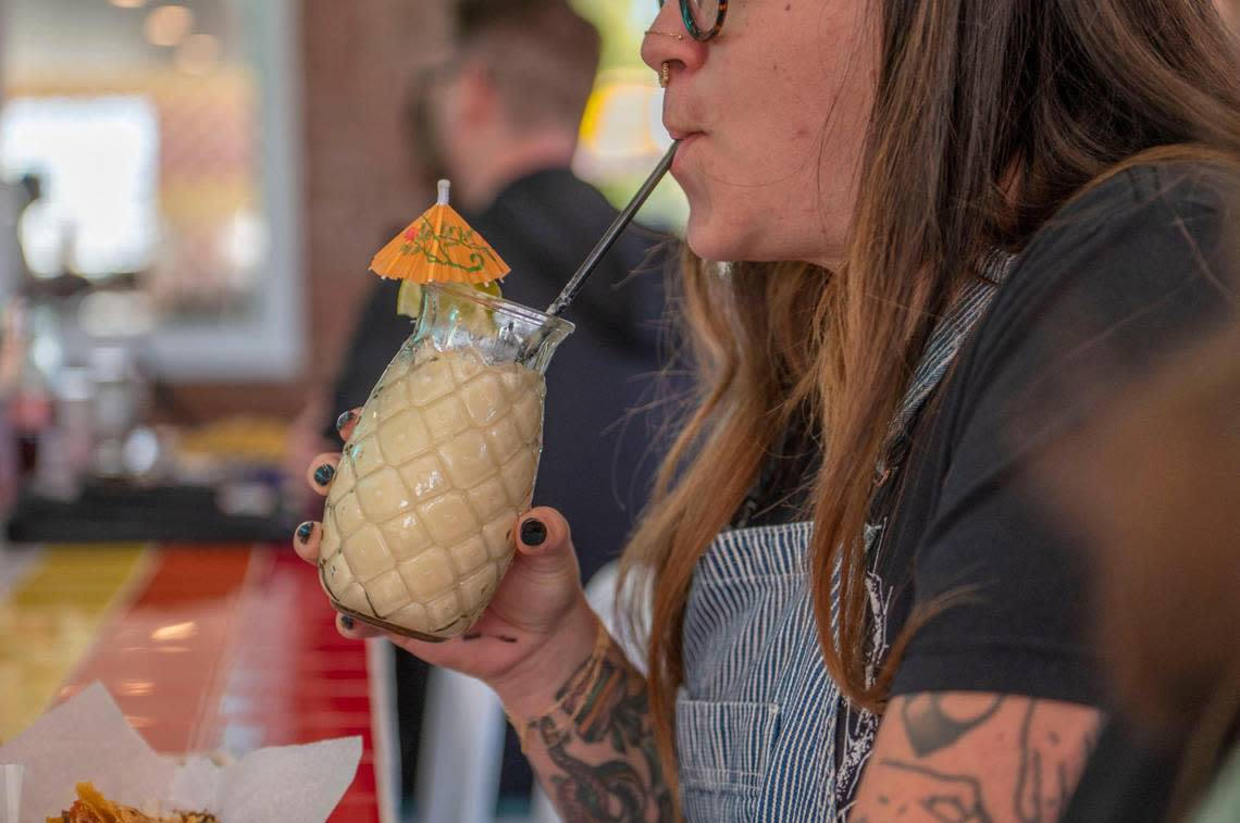 Shannon Austin drinks a pina colada at Tiki Taco.
