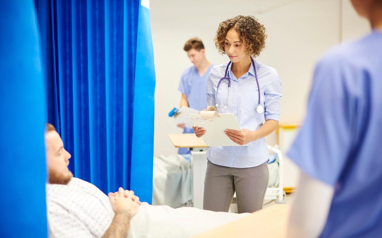 Doctor with patient in hospital