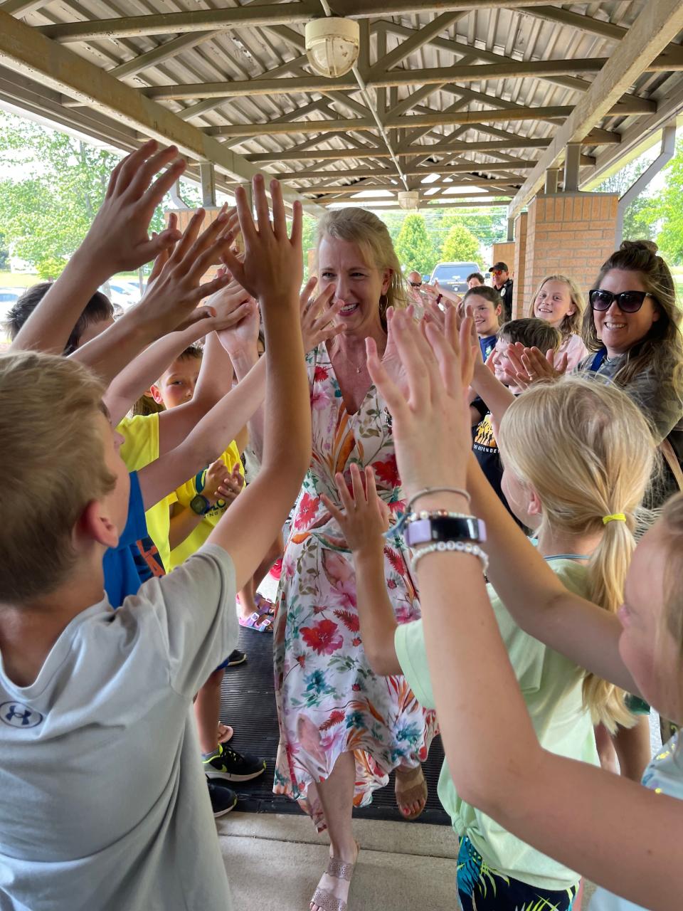 Glenn C. Marlow's students and faculty have a big welcome back for fourth grade teacher Karen Whiting after she was named Henderson County Public Schools' Teacher of the Year on Thursday.