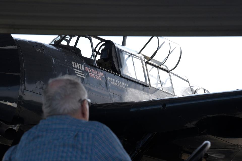 Robert Doane looks out to the TBM Avenger Torpedo Bomber that landed in Monmouth Executive Airport on Saturday, July 22, 2023 in Wall, New Jersey. 