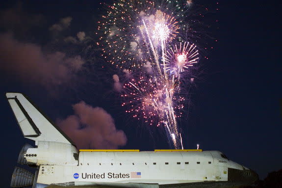 Space shuttle Atlantis’ arrival at the Kennedy Space Center Visitor Complex in Florida is marked by celebration and fireworks. Atlantis made the 10-mile trip from Kennedy’s Vehicle Assembly Building to the visitor complex where it will be put