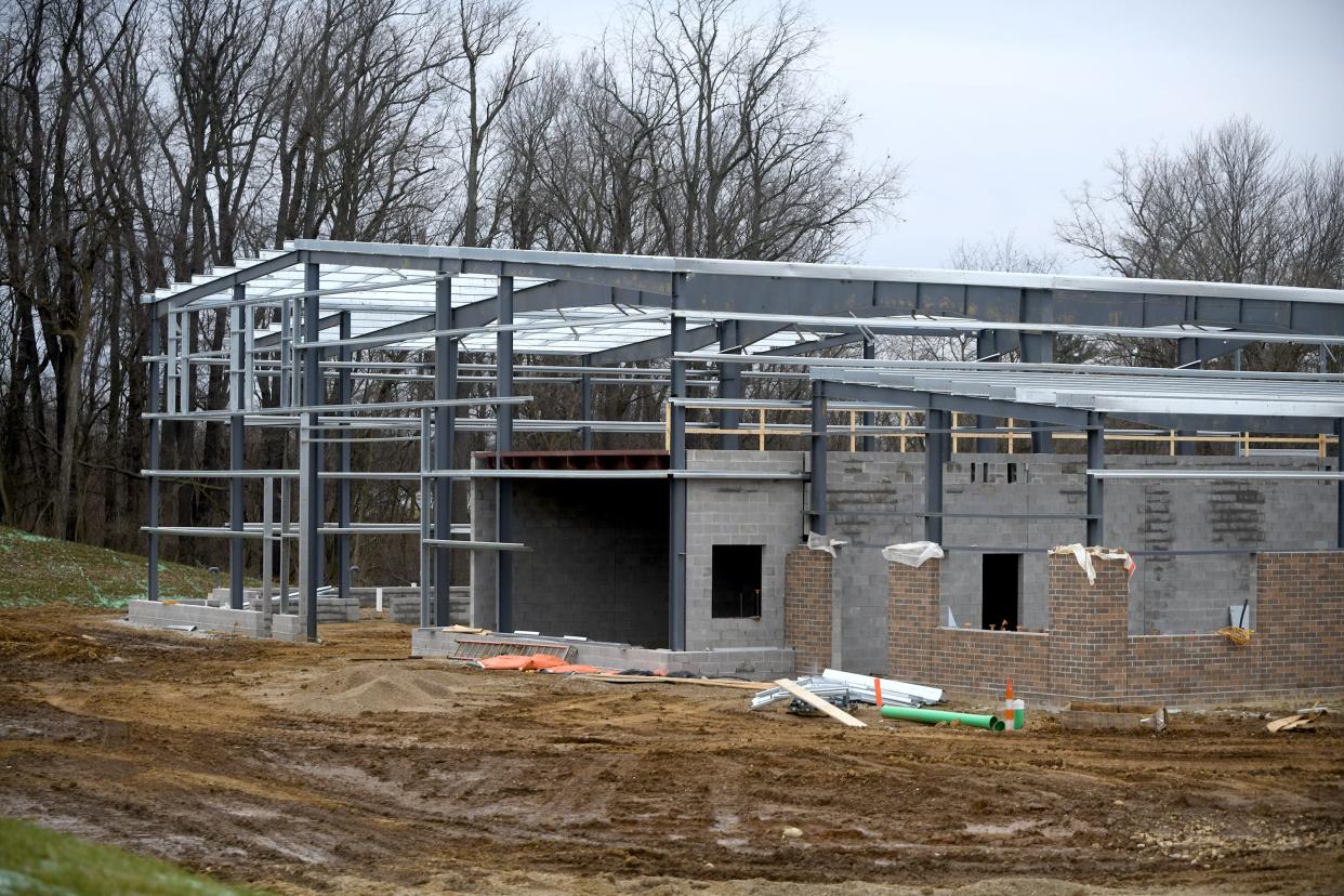 The frame of the new building being built for Canton's Sanitation Department is being constructed. City utility rates, which are increasing March 31, will pay off the $10 million loan needed for the project.