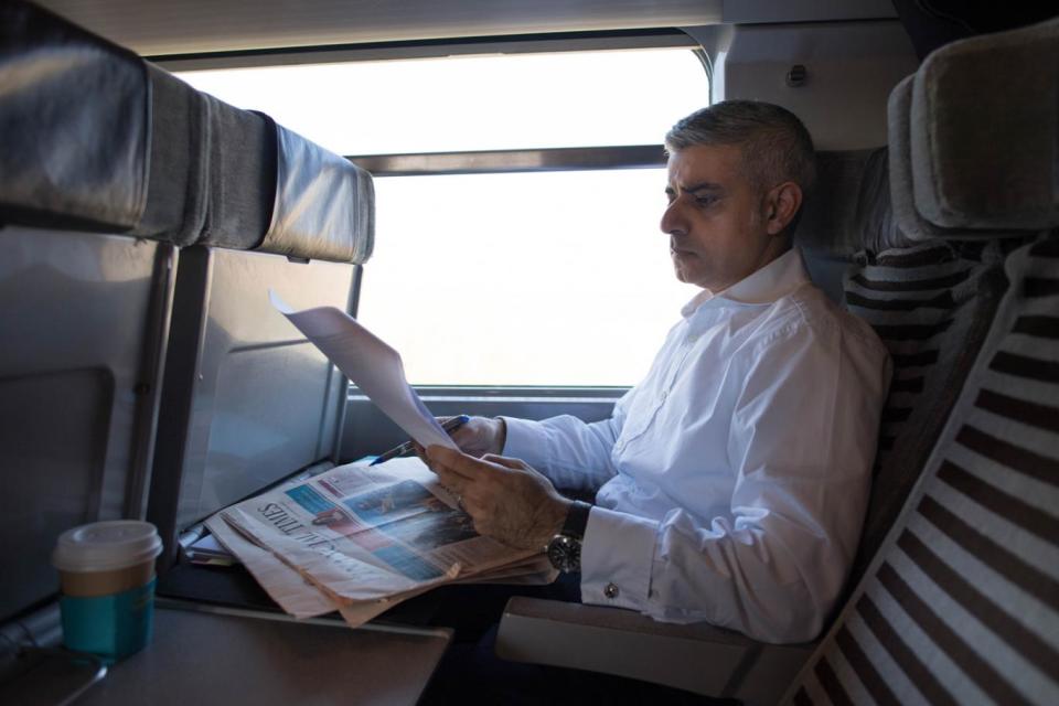 London Mayor Sadiq Khan on the train to Brussels (PA)