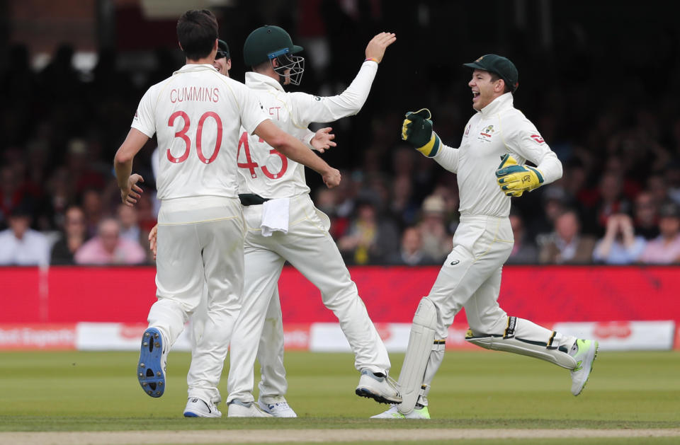 Australia's Cameron Bancroft, centre, celebrates after catching out England's Rory Burns during the second day of the second Ashes test match between England and Australia at Lord's cricket ground in London, Thursday, Aug. 15, 2019. (AP Photo/Frank Augstein)