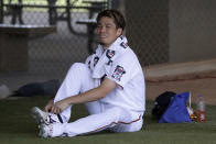 Minnesota Twins starting pitcher Kenta Maeda (18) ties his shoe before facing the Boston Red Sox a spring training baseball game Monday, Feb. 24, 2020, in Fort Myers, Fla. (AP Photo/John Bazemore)