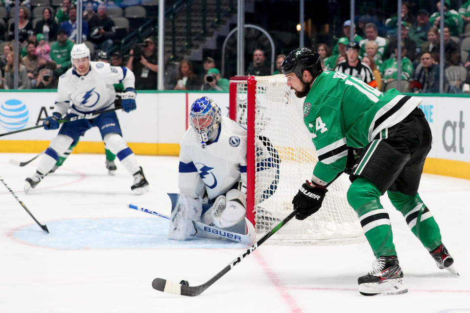 DALLAS, TEXAS - JANUARY 27: Jamie Benn #14 of the Dallas Stars controls the puck against Andrei Vasilevskiy #88 of the Tampa Bay Lightning in the first period at American Airlines Center on January 27, 2020 in Dallas, Texas. (Photo by Tom Pennington/Getty Images)